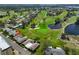 Scenic aerial view of the home, golf course, and surrounding community at 8940 Park Blvd # 8940A, Seminole, FL 33777