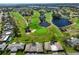 Overhead view of property highlighting a golf course and pond at 8940 Park Blvd # 8940A, Seminole, FL 33777
