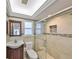 Cozy bathroom with a glass shower, stylish sink, and neutral tile design at 8940 Park Blvd # 8940A, Seminole, FL 33777
