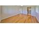 Spacious bedroom featuring hardwood floors, an ensuite bath, and views to the outside at 8940 Park Blvd # 8940A, Seminole, FL 33777