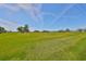 Picturesque golf course view featuring lush green grass and beautiful clear skies at 8940 Park Blvd # 8940A, Seminole, FL 33777