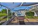 Secluded backyard hot tub with a fully screened enclosure and private landscaping at 8940 Park Blvd # 8940A, Seminole, FL 33777