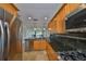 Updated kitchen with granite countertops, stainless steel appliances, and custom wood cabinets at 8940 Park Blvd # 8940A, Seminole, FL 33777