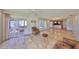 Open living room featuring tile floors, sliding glass doors, and a view of the hot tub at 8940 Park Blvd # 8940A, Seminole, FL 33777