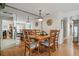 Elegant dining area with hardwood floors and ample seating, great for entertaining guests at 906 Alpine Dr, Brandon, FL 33510