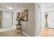 Inviting hallway featuring decorative art, tile flooring, and access to multiple rooms, creating a welcoming transition at 906 Alpine Dr, Brandon, FL 33510