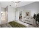Bright bedroom showing doorway to bathroom and open door into living room with plenty of natural light at 9808 62Nd N Ter # 9808, St Petersburg, FL 33708