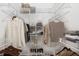 Well-organized walk-in closet with shelving and hanging space for efficient storage of clothes and shoes at 9808 62Nd N Ter # 9808, St Petersburg, FL 33708