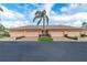 The building's exterior features an attached garage, lovely landscaping, and a well-maintained brick driveway at 9808 62Nd N Ter # 9808, St Petersburg, FL 33708