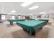 Spacious game room with pool tables, high ceilings and large windows for community enjoyment at 9808 62Nd N Ter # 9808, St Petersburg, FL 33708