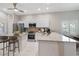 Bright kitchen features granite countertops, stainless appliances, breakfast bar and tile floors at 9808 62Nd N Ter # 9808, St Petersburg, FL 33708