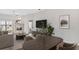 Open living space featuring wood floors, fireplace, neutral decor, and lots of natural light at 9808 62Nd N Ter # 9808, St Petersburg, FL 33708
