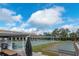 Community shuffleboard court and grilling area for outdoor recreation at 9808 62Nd N Ter # 9808, St Petersburg, FL 33708