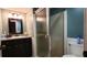 Modern bathroom featuring a glass-enclosed shower, stylish vanity with sink, and a coordinated mirror, offering a spa-like retreat at 11204 Pembridge Ct # 5, Port Richey, FL 34668