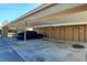 Convenient carport area with designated parking spaces, offering sheltered parking and easy access to the residential units at 11204 Pembridge Ct # 5, Port Richey, FL 34668