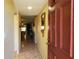 Inviting entryway with tile flooring and neutral paint, leading to the main living area at 11204 Pembridge Ct # 5, Port Richey, FL 34668