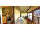 Relaxing Florida room with a dining area and ceiling fan that offers a peaceful retreat with natural light and comfortable seating at 11204 Pembridge Ct # 5, Port Richey, FL 34668