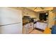 Clean kitchen with white cabinets and appliances offering plenty of storage space at 11204 Pembridge Ct # 5, Port Richey, FL 34668