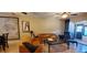 Relaxing living room with comfortable seating, sliding glass doors, and decor at 11204 Pembridge Ct # 5, Port Richey, FL 34668