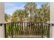 Balcony view of palm trees and retail in this condo community at 111 N Albany Ave # 3, Tampa, FL 33606