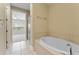 Large bathtub in bathroom adjacent to walk-in shower and bedroom at 111 N Albany Ave # 3, Tampa, FL 33606
