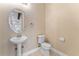 Powder room featuring pedestal sink and oval mirror at 111 N Albany Ave # 3, Tampa, FL 33606