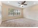 Spacious bedroom with neutral carpet, large window and ceiling fan at 111 N Albany Ave # 3, Tampa, FL 33606