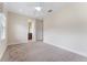 Neutral carpeted bedroom with ceiling fan and ensuite bathroom access at 111 N Albany Ave # 3, Tampa, FL 33606