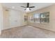 Spacious bedroom with neutral carpet, large closet, and windows at 111 N Albany Ave # 3, Tampa, FL 33606