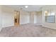 Large bedroom with neutral carpeting, ceiling fan and ensuite bathroom access at 111 N Albany Ave # 3, Tampa, FL 33606