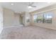 Spacious bedroom with plush carpeting, ceiling fan, and access to balcony at 111 N Albany Ave # 3, Tampa, FL 33606