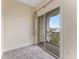 Neutral carpeted bedroom with balcony access through sliding glass doors at 111 N Albany Ave # 3, Tampa, FL 33606