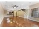 Bright living room showcasing hardwood floors, recessed lighting, and an open layout with a view of the kitchen at 111 N Albany Ave # 3, Tampa, FL 33606