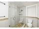Updated bathroom with glass enclosed shower and toilet at 1122 S Mulrennan Rd, Valrico, FL 33594