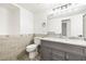 Updated bathroom with tile accents, grey vanity and new fixtures at 1122 S Mulrennan Rd, Valrico, FL 33594