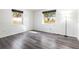 Sunlit bedroom showcases modern floors, white walls, and two bright windows at 1122 S Mulrennan Rd, Valrico, FL 33594