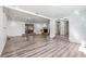 Spacious living area with fireplace and gray wood-look flooring at 1122 S Mulrennan Rd, Valrico, FL 33594