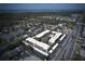 A desirable condo community with a pool, carports, and mature landscaping, as seen from above at 11620 Park Blvd # 308, Seminole, FL 33772