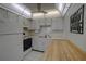 Functional kitchen features white cabinets, ample counter space, and appliances at 11620 Park Blvd # 308, Seminole, FL 33772