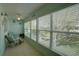 Bright lanai offering serene views, comfortable seating, and a peaceful atmosphere for relaxation at 11620 Park Blvd # 308, Seminole, FL 33772