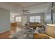 Open-concept living and dining area with ceiling fans, and comfortable seating at 11620 Park Blvd # 308, Seminole, FL 33772