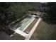 Aerial shot of community shuffleboard court with mature trees and a covered picnic area at 11620 Park Blvd # 308, Seminole, FL 33772