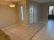 Dining area with tile floors, pendant lighting, and a large window at 1179 Pine Ridge Cir W # A1, Tarpon Springs, FL 34688