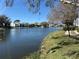 Beautiful pond with fountain surrounded by landscaped community at 1179 Pine Ridge Cir W # A1, Tarpon Springs, FL 34688