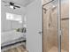 Clean and bright bathroom features a glass-enclosed shower next to the main bedroom at 1208 E Kennedy Blvd # 1019, Tampa, FL 33602