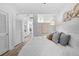Bright bedroom featuring white walls, light floors, and stylish decor with a view at 1208 E Kennedy Blvd # 1019, Tampa, FL 33602