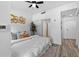 Bright bedroom features a modern ceiling fan, and a walk-in closet and bathroom entrance at 1208 E Kennedy Blvd # 1019, Tampa, FL 33602