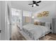 Bright bedroom featuring white walls, light floors, and stylish decor with a view at 1208 E Kennedy Blvd # 1019, Tampa, FL 33602