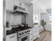 Bright kitchen features stainless steel appliances, white cabinetry and modern backsplash at 1208 E Kennedy Blvd # 1019, Tampa, FL 33602