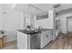 Open-concept kitchen with stainless steel appliances and an adjacent bedroom at 1208 E Kennedy Blvd # 1019, Tampa, FL 33602